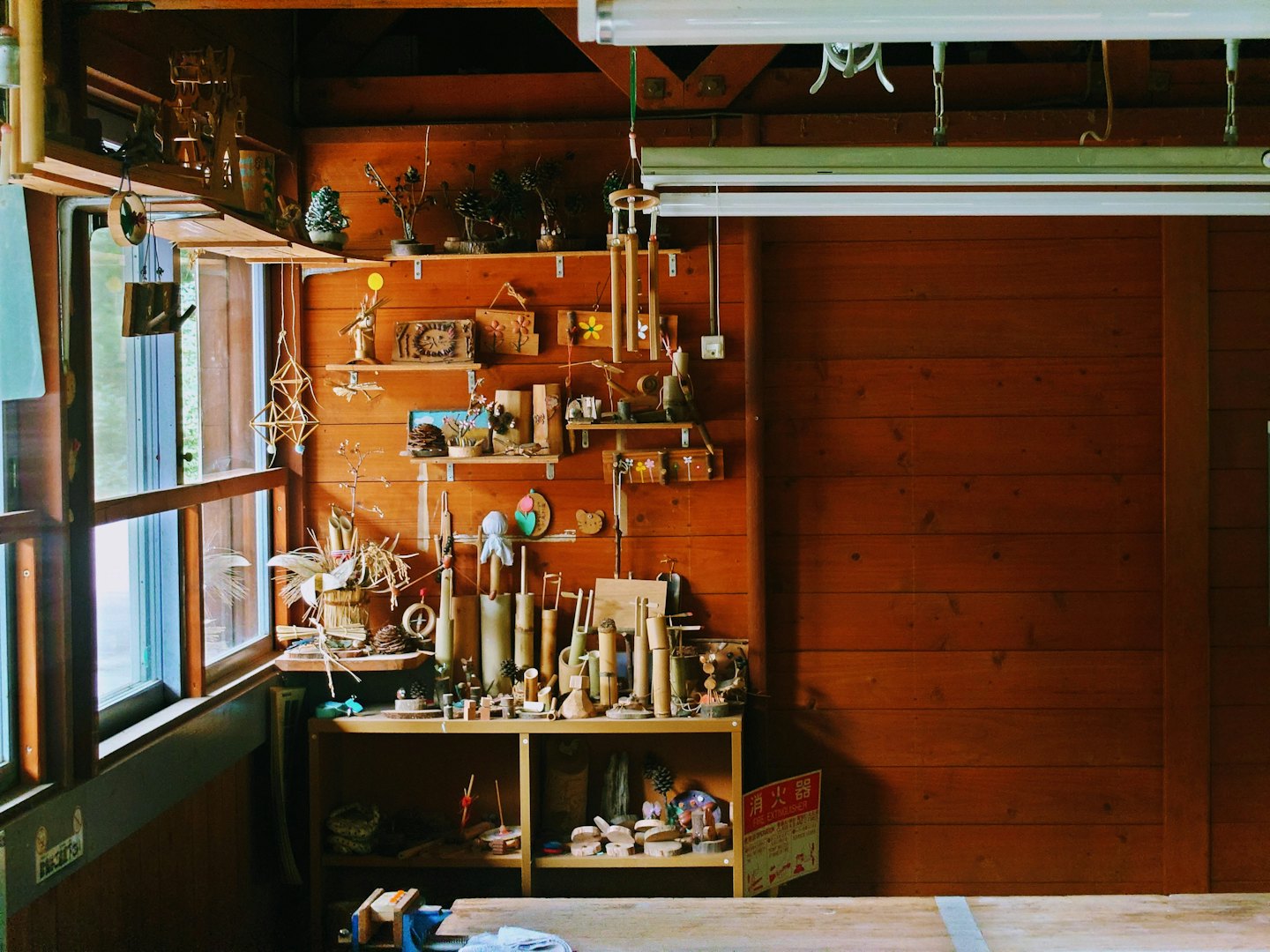 Handmade wooden crafts displayed in a rustic workshop.